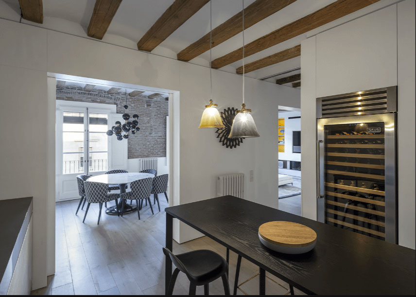 A modern apartment with brick walls and exposed beams in Medieval Barcelona