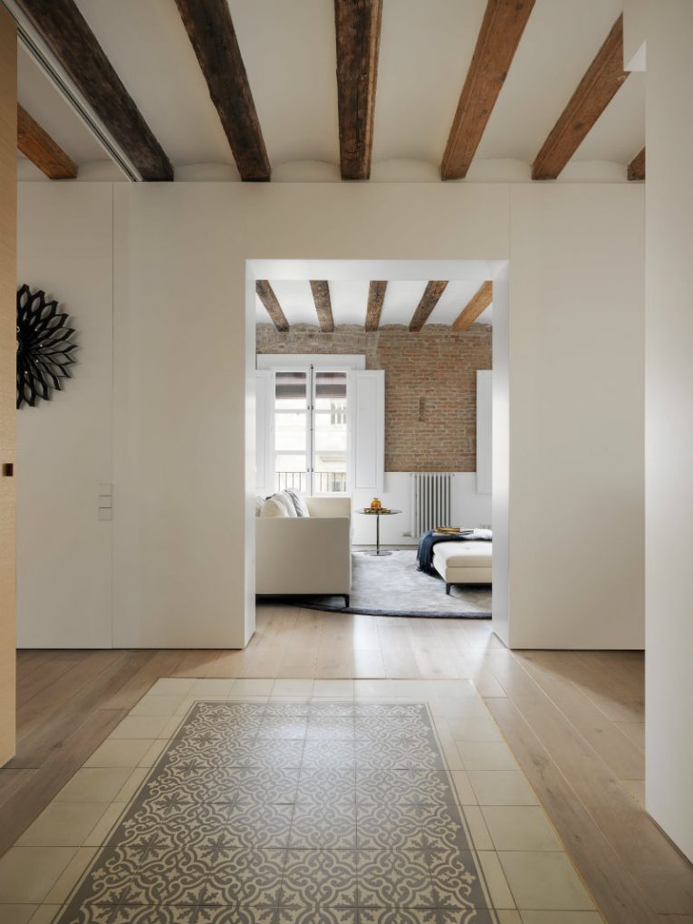 A modern apartment with brick walls and exposed beams in Medieval Barcelona