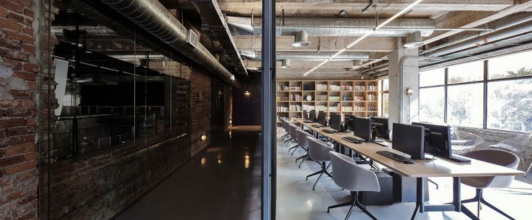 Industrial Office Features Exposed Bricks & Concrete Ceilings 1