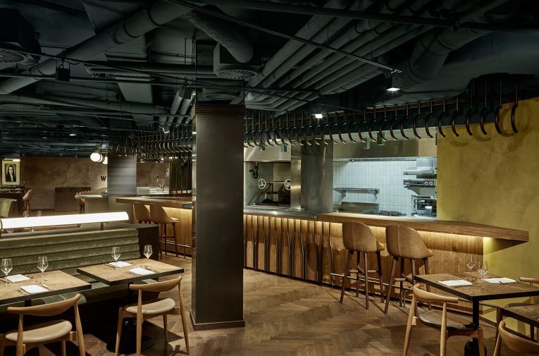 A Retro Café in Amsterdam Boasts a White Marble Bar and Exposed Pipes 4