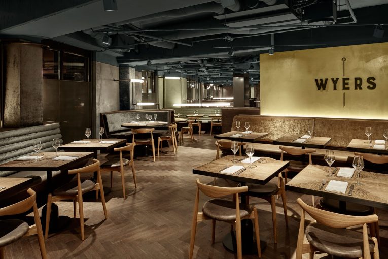 A Retro Café in Amsterdam Boasts a White Marble Bar and Exposed Pipes 4